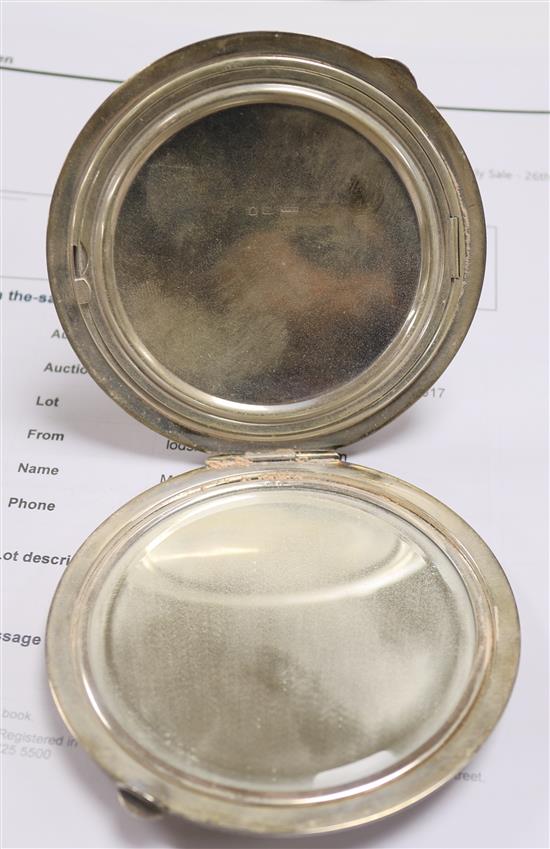 Two silver compacts and two engine turned silver cigarette cases including one modelled as a book.